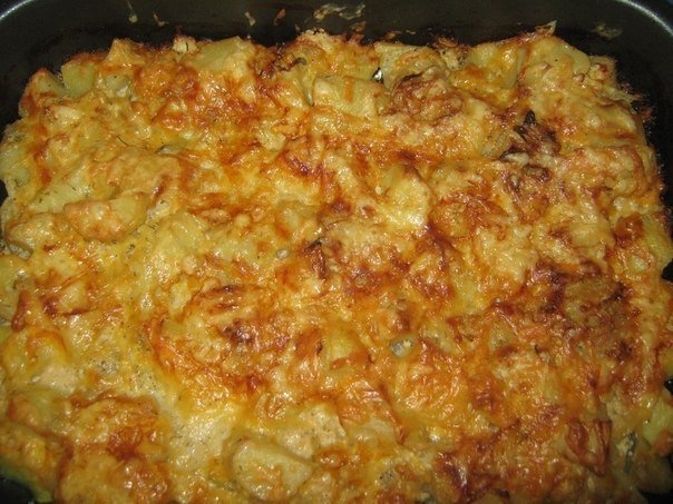 Фото к рецепту: Картошка запеченная в кефире под сыром
